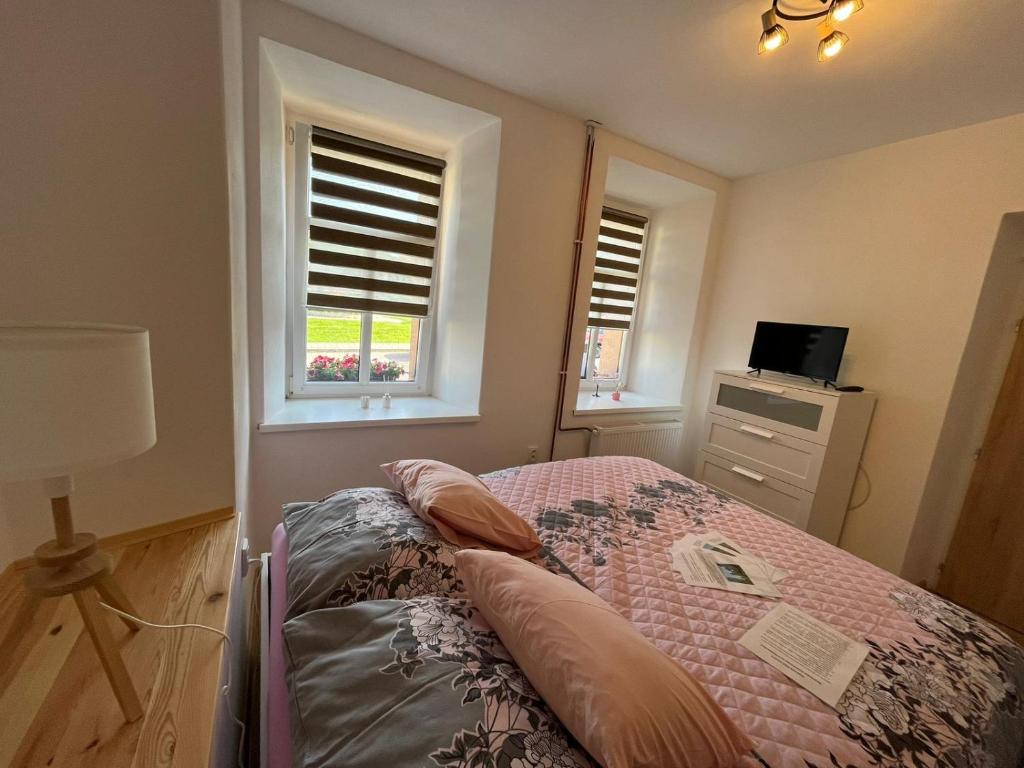 Posteľ alebo postele v izbe v ubytovaní Apartmán Kostomlaty pod Milešovkou