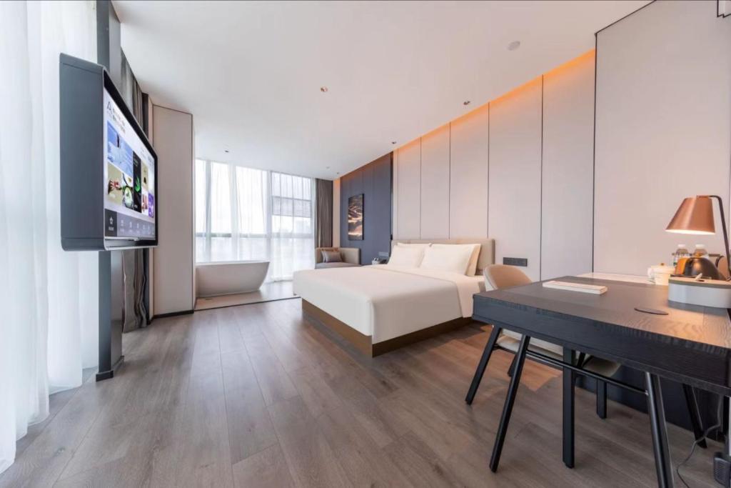 Postel nebo postele na pokoji v ubytování Atour Hotel Guangzhou Huangpu Development Zone Baoying