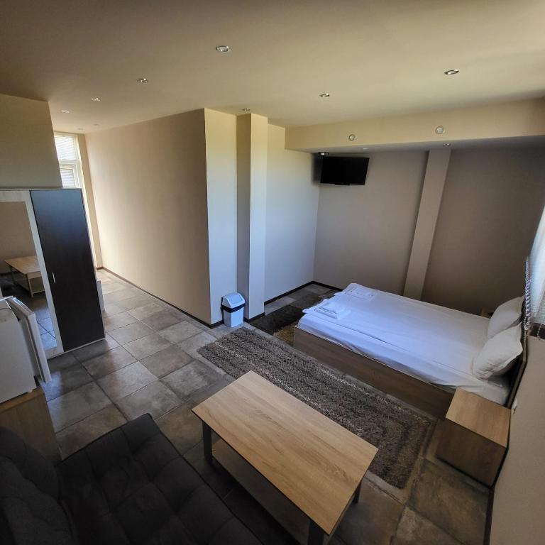 Postel nebo postele na pokoji v ubytování Hotel Sunrise