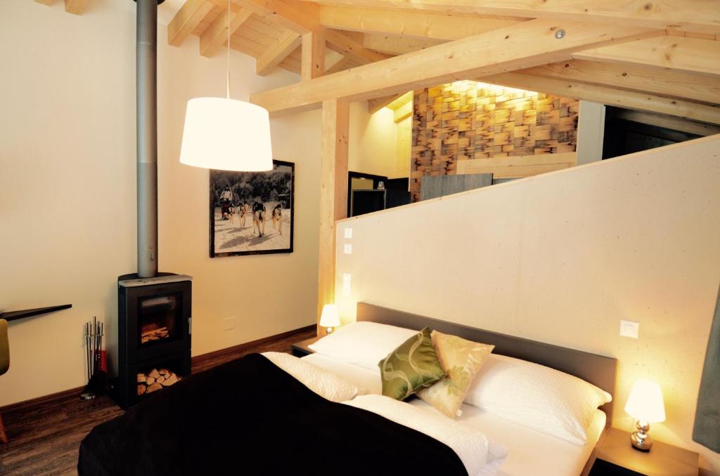 Postel nebo postele na pokoji v ubytování Hüttenhotel Husky Lodge