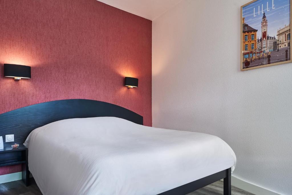 Postel nebo postele na pokoji v ubytování Hôtel Agena