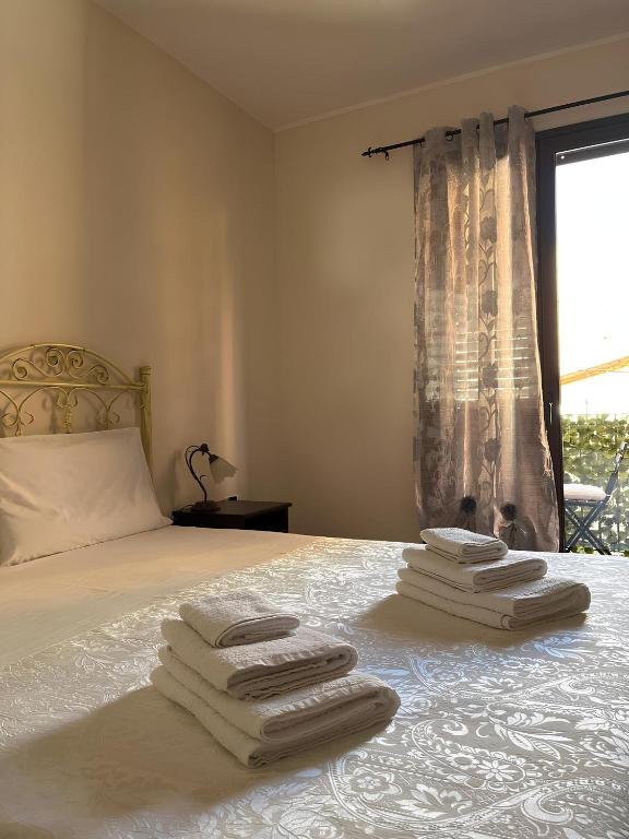 Postel nebo postele na pokoji v ubytování Le Residenze di Niso