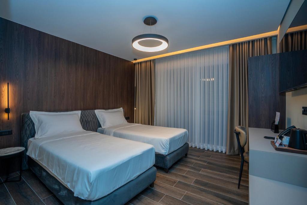 Postel nebo postele na pokoji v ubytování Hotel Mozart