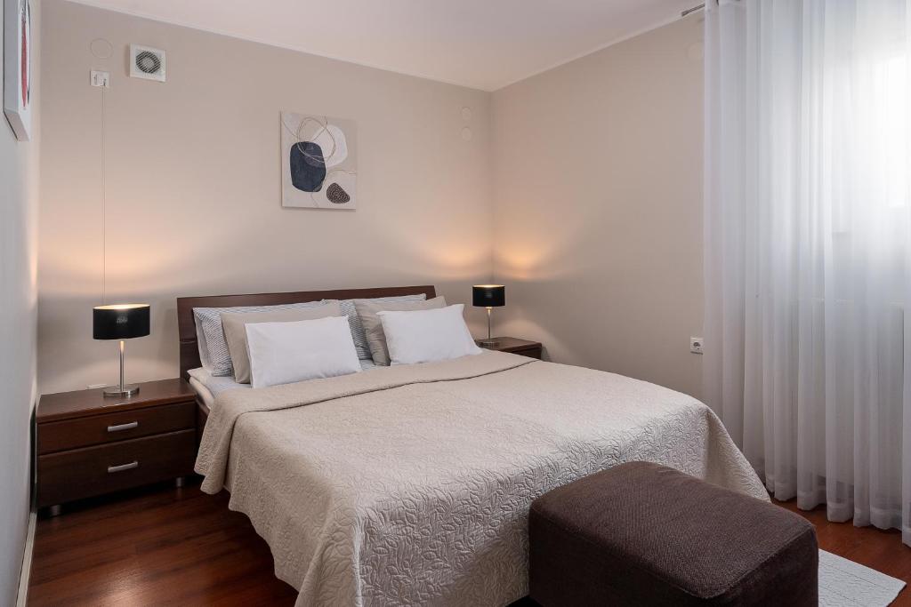 Postel nebo postele na pokoji v ubytování Apartman Neli