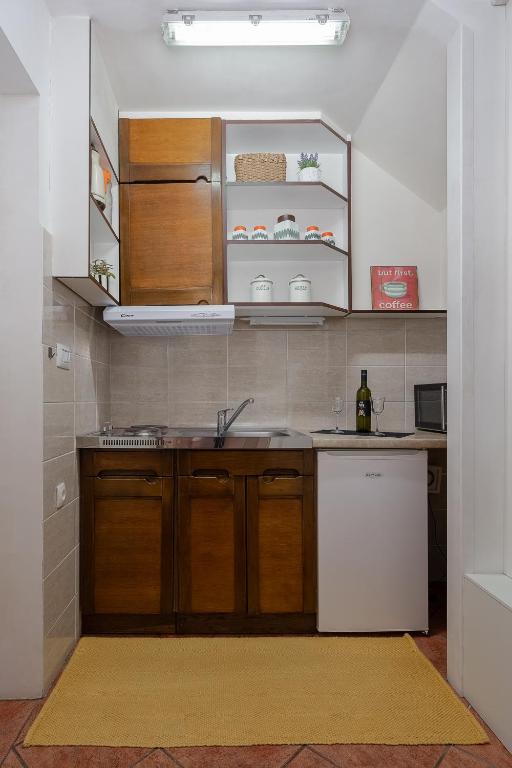 Kuchyň nebo kuchyňský kout v ubytování Apartman Neli