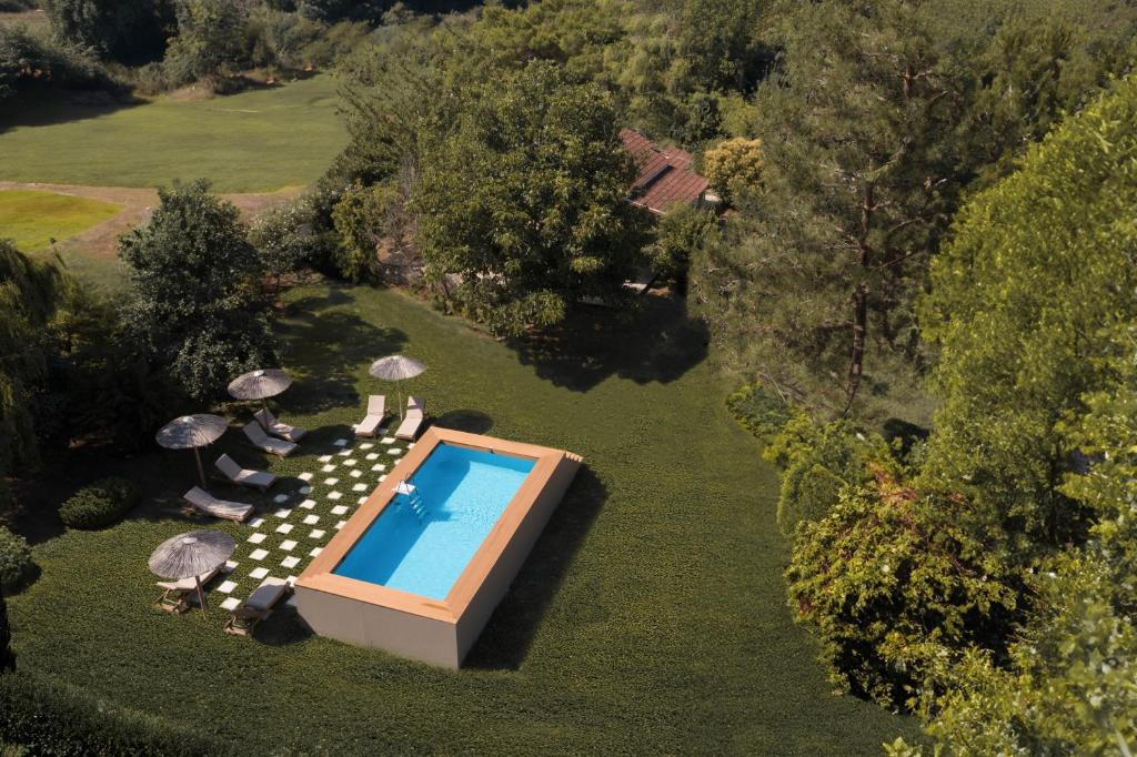 an overhead view of a swimming pool in a yard at Erifili Apartments in Sidari