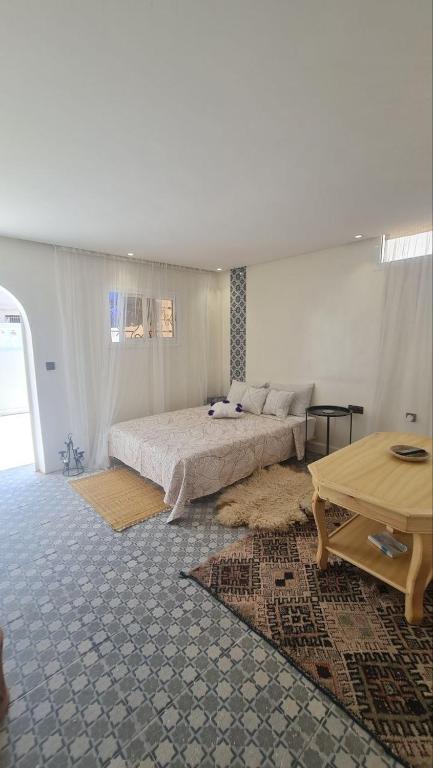 Postel nebo postele na pokoji v ubytování Tambarkiyt House Studio Appartement - Aourir Agadir