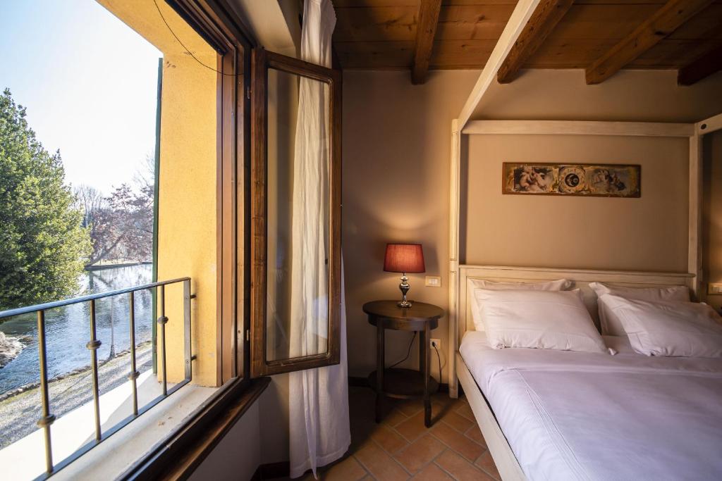 Postel nebo postele na pokoji v ubytování Villa dei Mulini