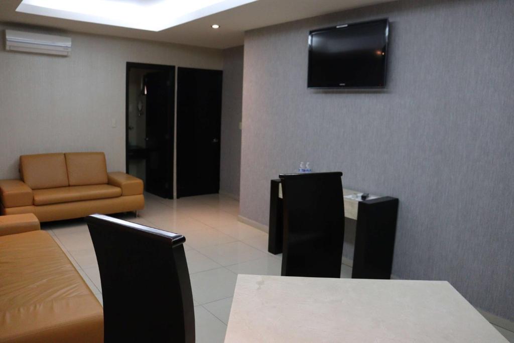 TV a/nebo společenská místnost v ubytování Wyndham Garden Aguascalientes Hotel & Casino