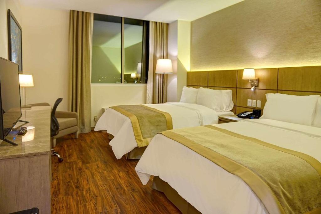 Postel nebo postele na pokoji v ubytování Radisson Hotel Guayaquil