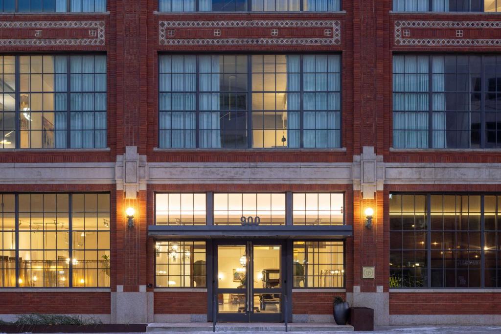 a large brick building with many windows and doors at Fordson Hotel, in the Unbound Collection by Hyatt in Oklahoma City