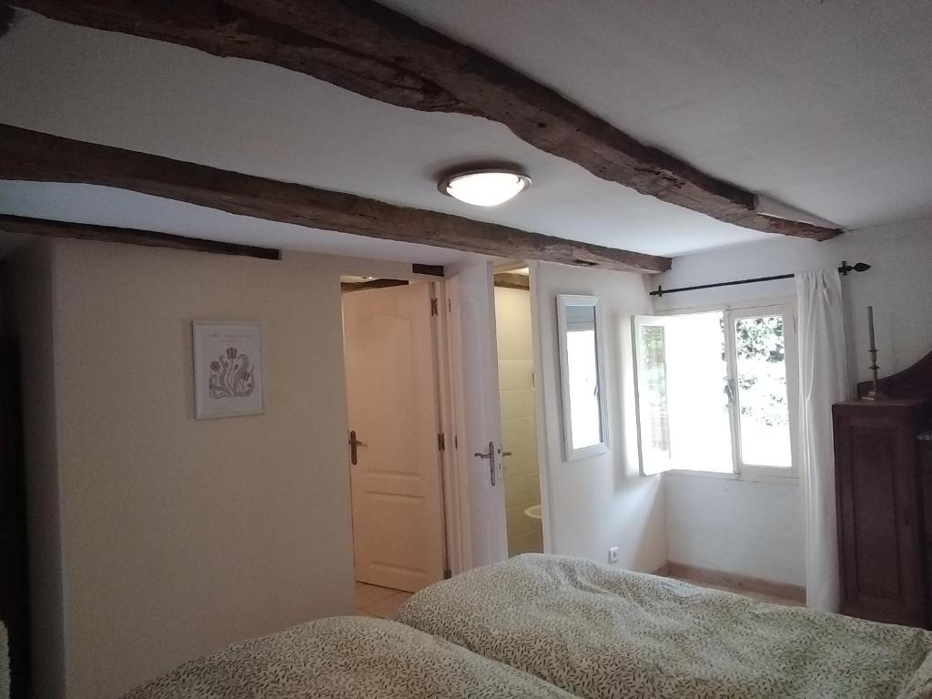 Postel nebo postele na pokoji v ubytování Domaine de Cadenne