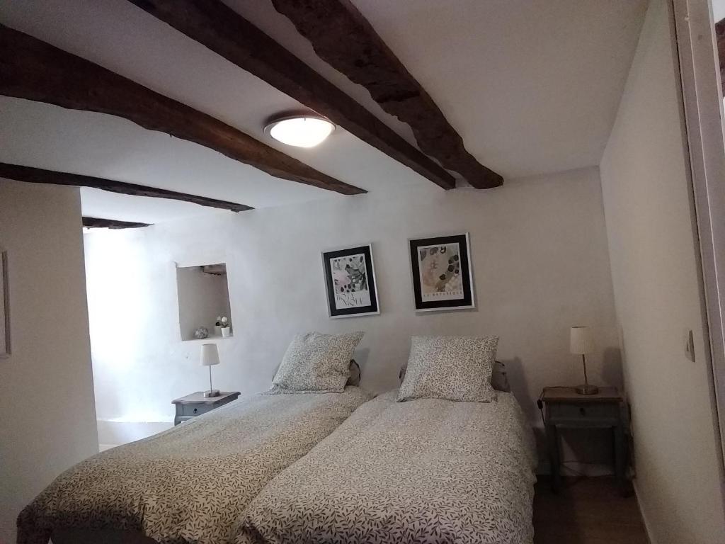 Postel nebo postele na pokoji v ubytování Domaine de Cadenne