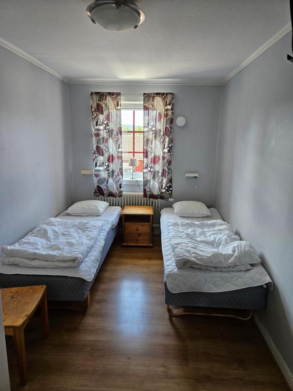 Postel nebo postele na pokoji v ubytování Idrefjällens Sport Hostel