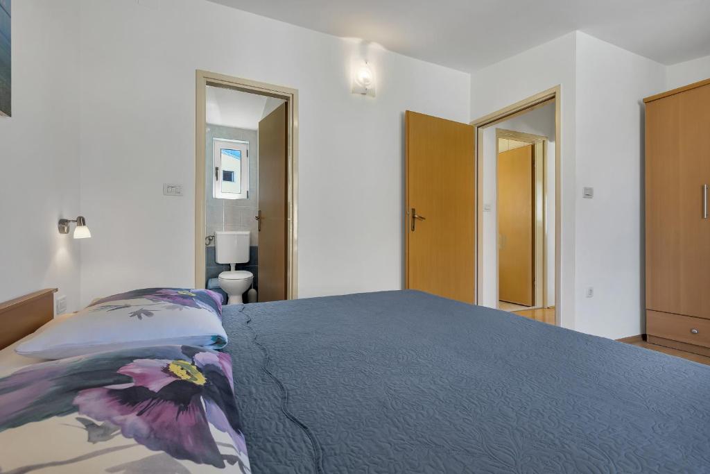 Posteľ alebo postele v izbe v ubytovaní Apartman KLARA 2
