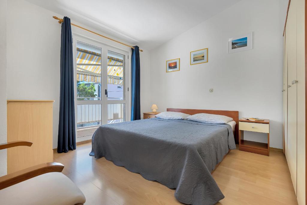 Posteľ alebo postele v izbe v ubytovaní Apartman KLARA 2