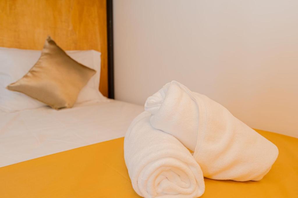 Postel nebo postele na pokoji v ubytování Kamkan Hostel