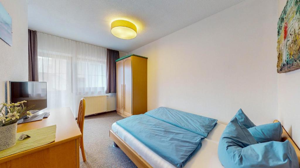 Postel nebo postele na pokoji v ubytování Café Pension Heim