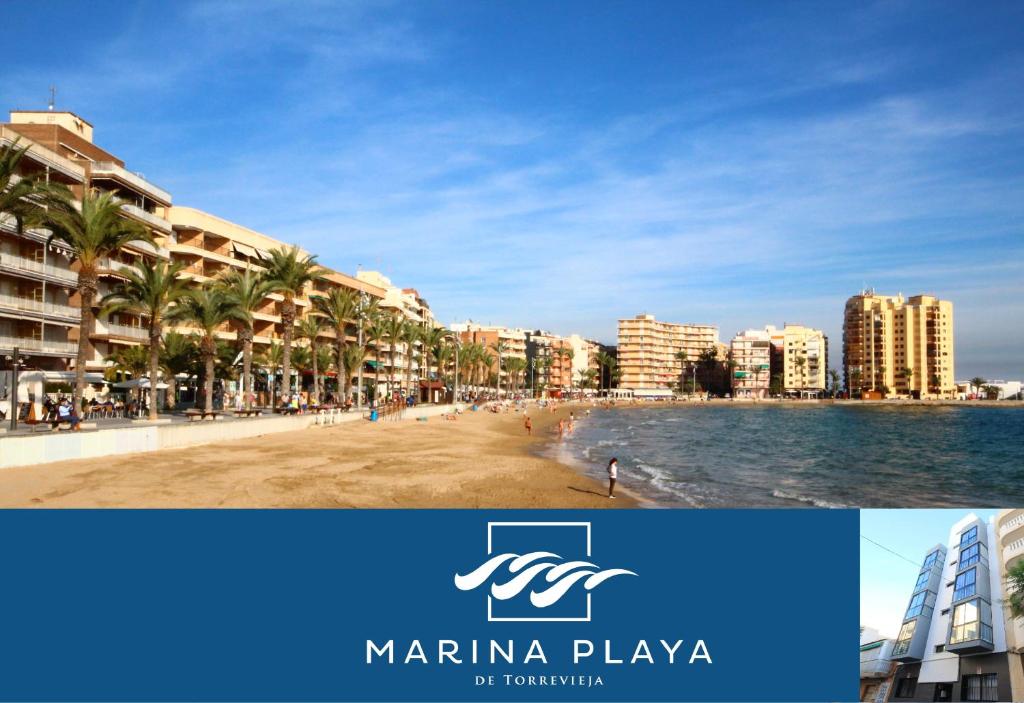 a view of a beach in a city with buildings at Apartamentos Marina Playa de Torrevieja in Torrevieja