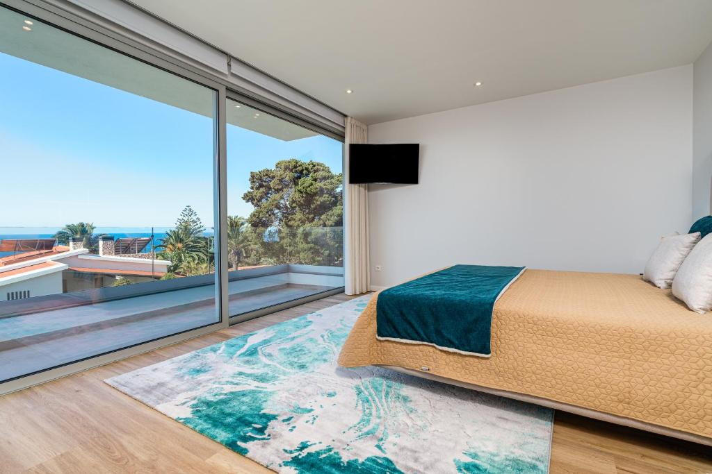 Ένα ή περισσότερα κρεβάτια σε δωμάτιο στο El Dourado House
