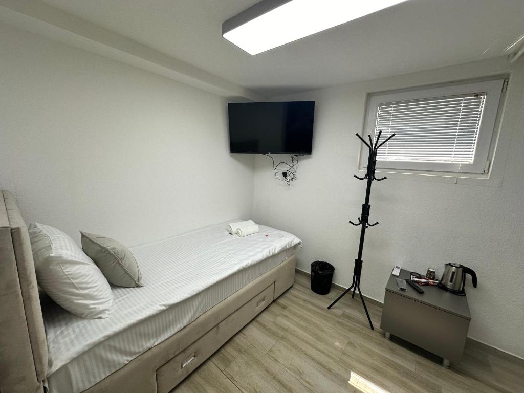 Postel nebo postele na pokoji v ubytování Next Rooms