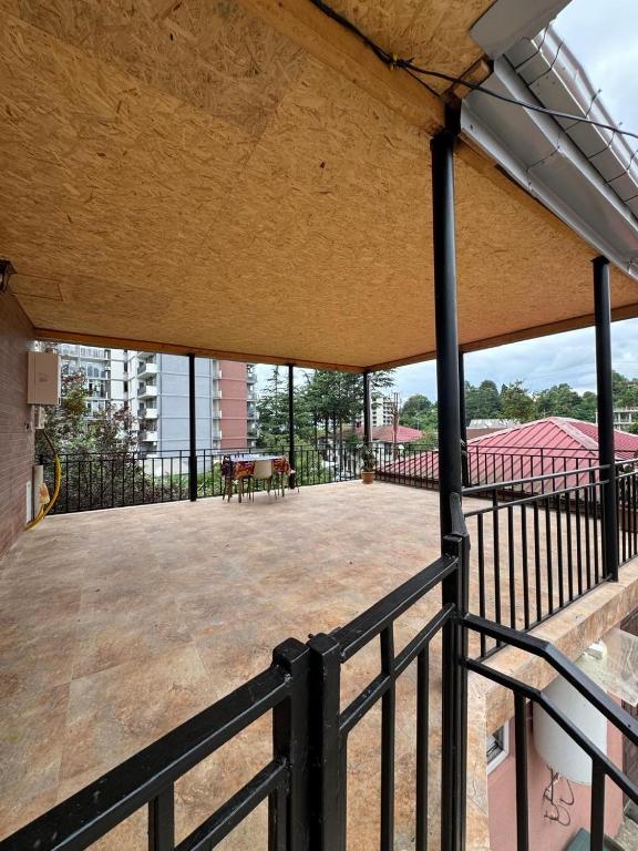 an empty deck with a bench on a balcony at House Nature Sea in Makhinjauri