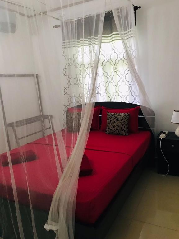 Postel nebo postele na pokoji v ubytování Kavee Transit Hotel