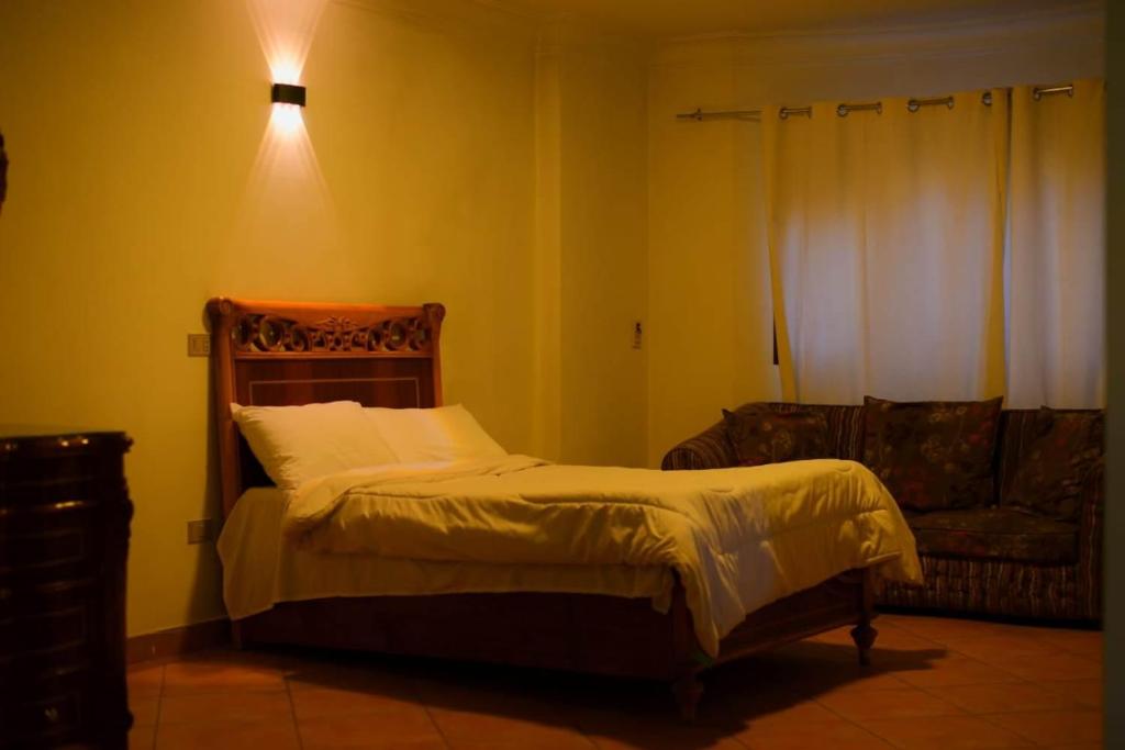 Postel nebo postele na pokoji v ubytování Sofia Guest House