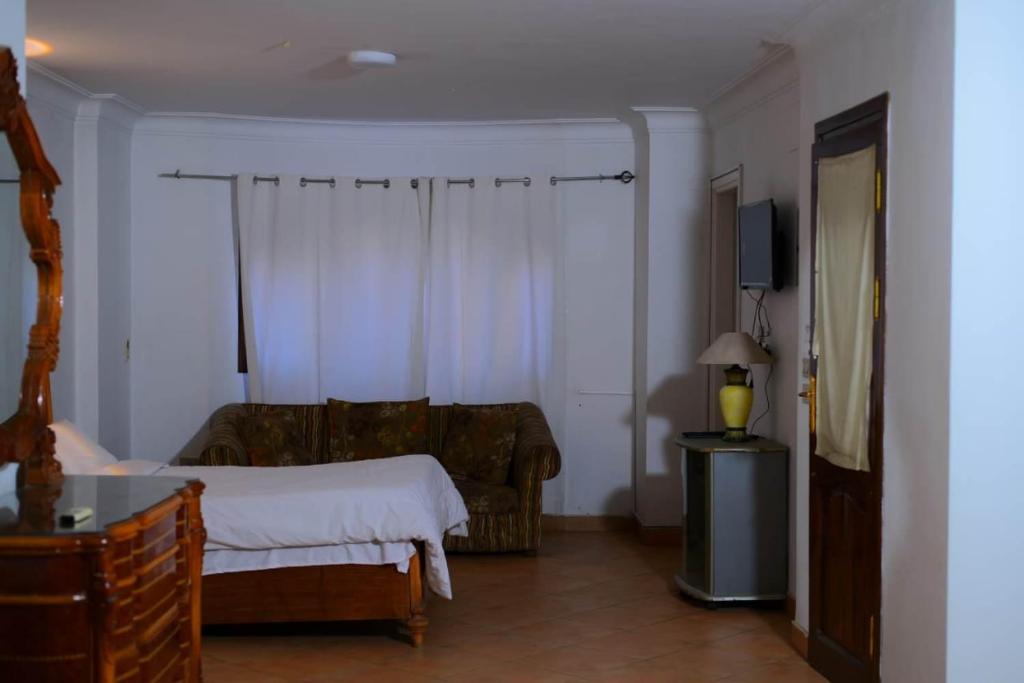 Postel nebo postele na pokoji v ubytování Sofia Guest House