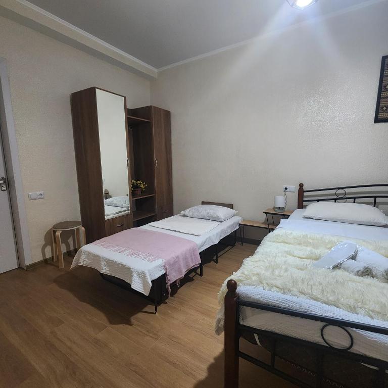 Postel nebo postele na pokoji v ubytování PANORAMA family hotel