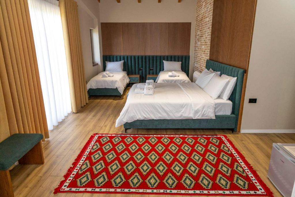 Postel nebo postele na pokoji v ubytování Hani Gështenjave