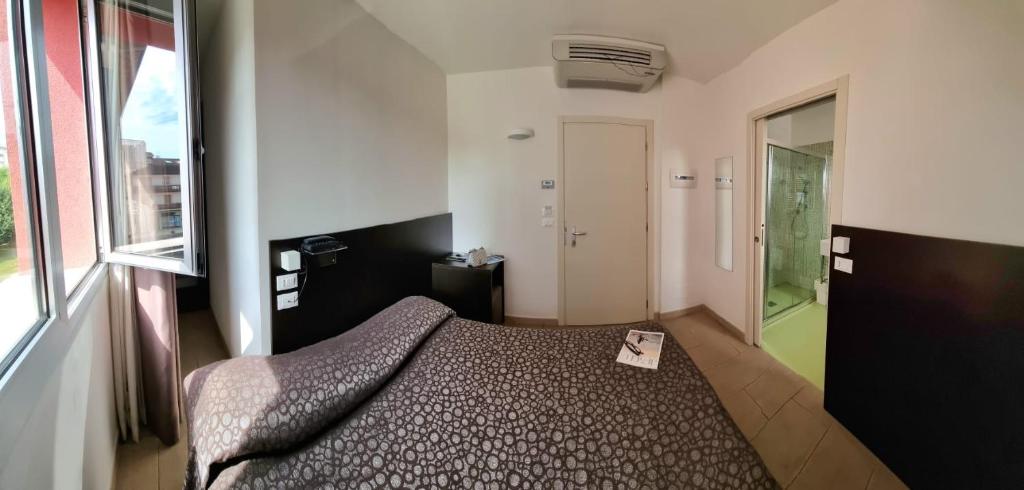 Łóżko lub łóżka w pokoju w obiekcie Hotel Morena