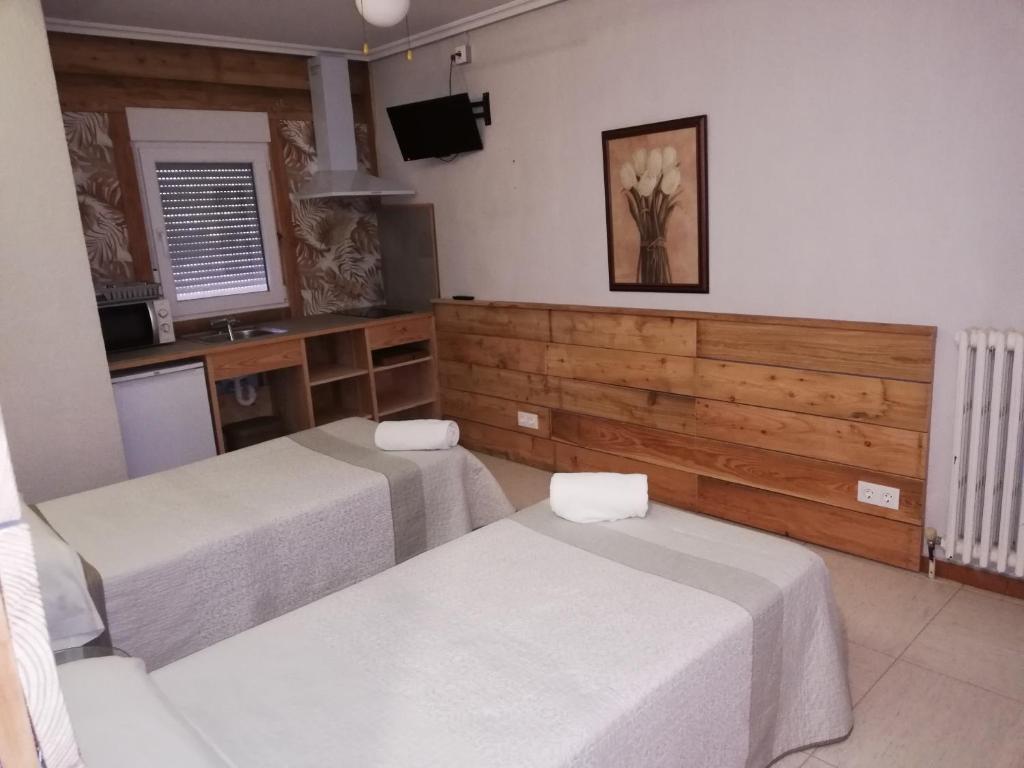 Postel nebo postele na pokoji v ubytování Hostal Ochoa