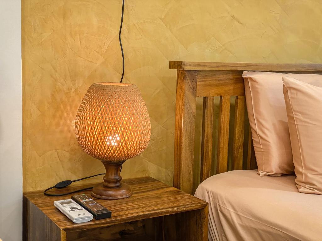 Postel nebo postele na pokoji v ubytování Muni La Maison