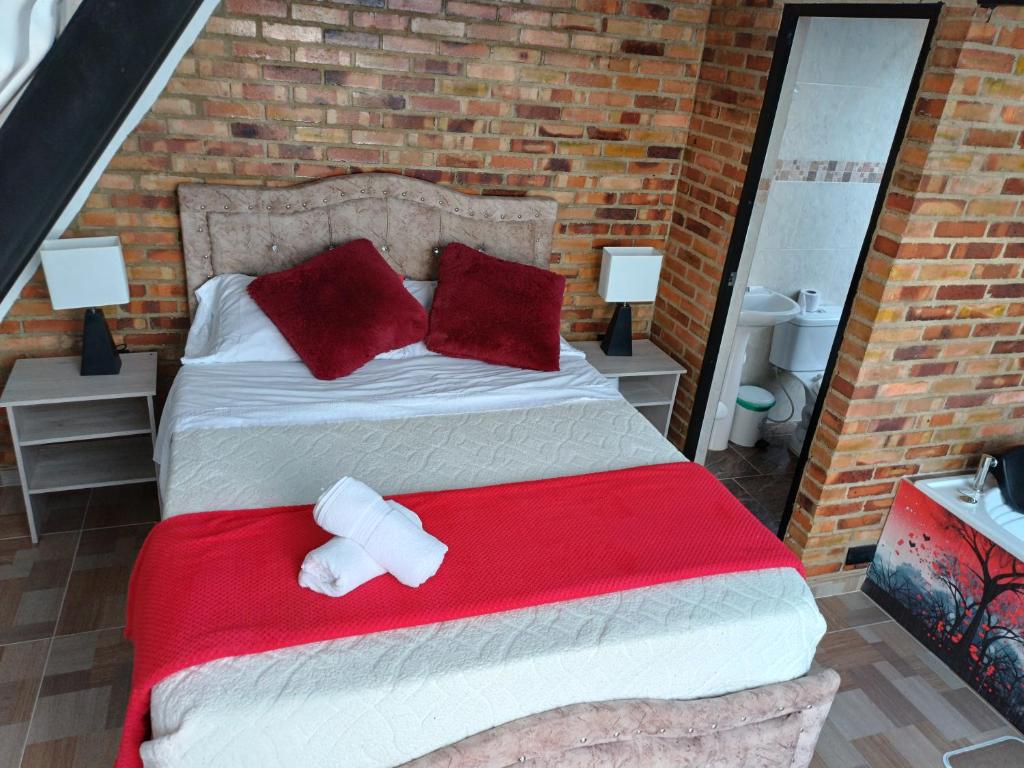 Postel nebo postele na pokoji v ubytování Chalet el encantó San Francisco cundimarca