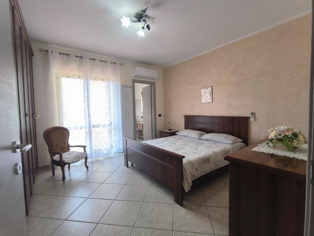 Postel nebo postele na pokoji v ubytování Aria Di mare b&b family