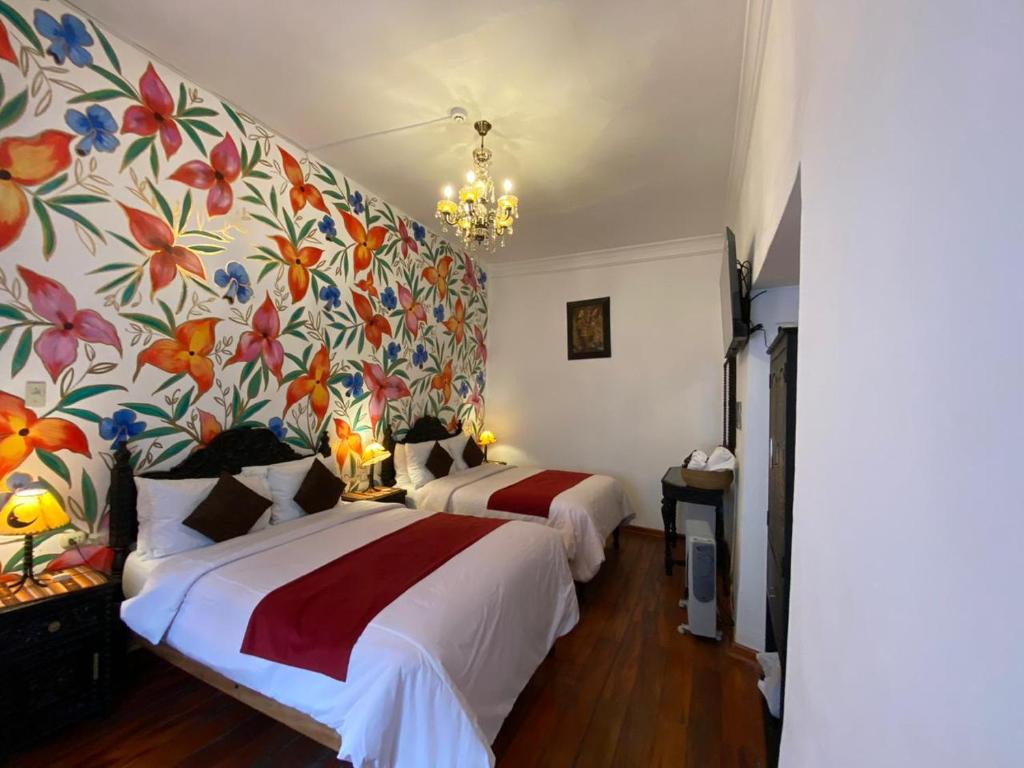 Postel nebo postele na pokoji v ubytování Casona Dorada Hotel Cusco
