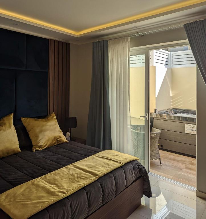 Postel nebo postele na pokoji v ubytování Domus Boutique Hotel