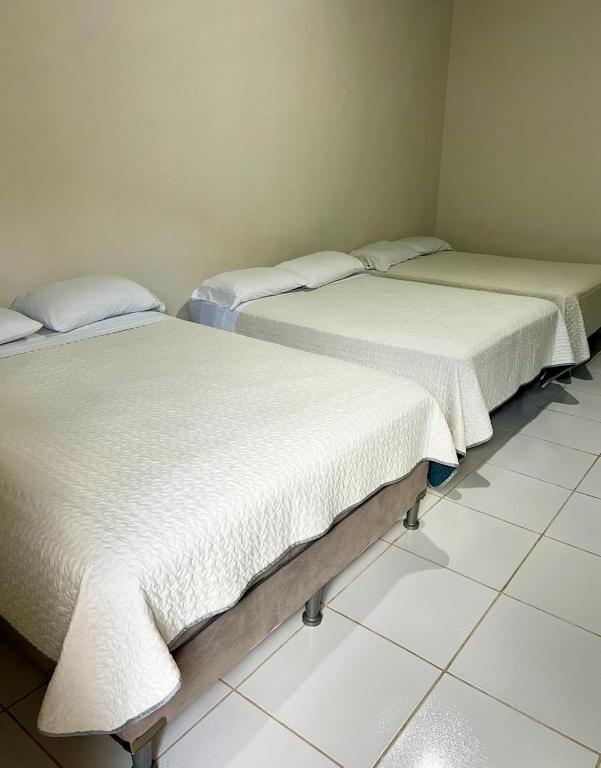Postel nebo postele na pokoji v ubytování Aparta Hotel Palmerola