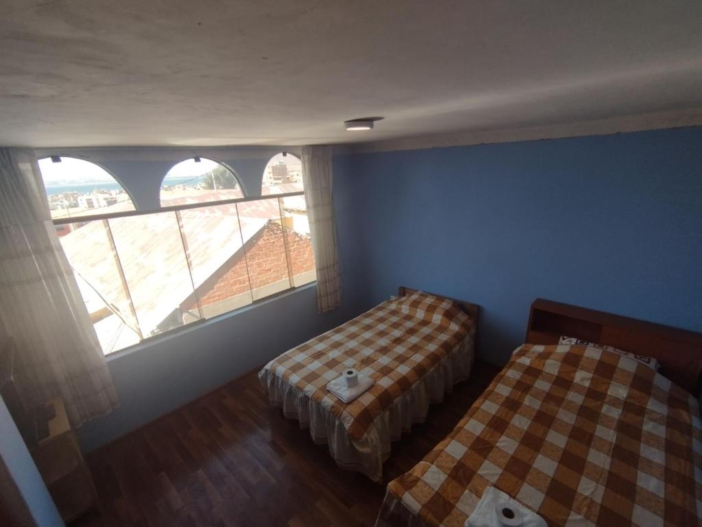 Postel nebo postele na pokoji v ubytování Inti Ut'ha