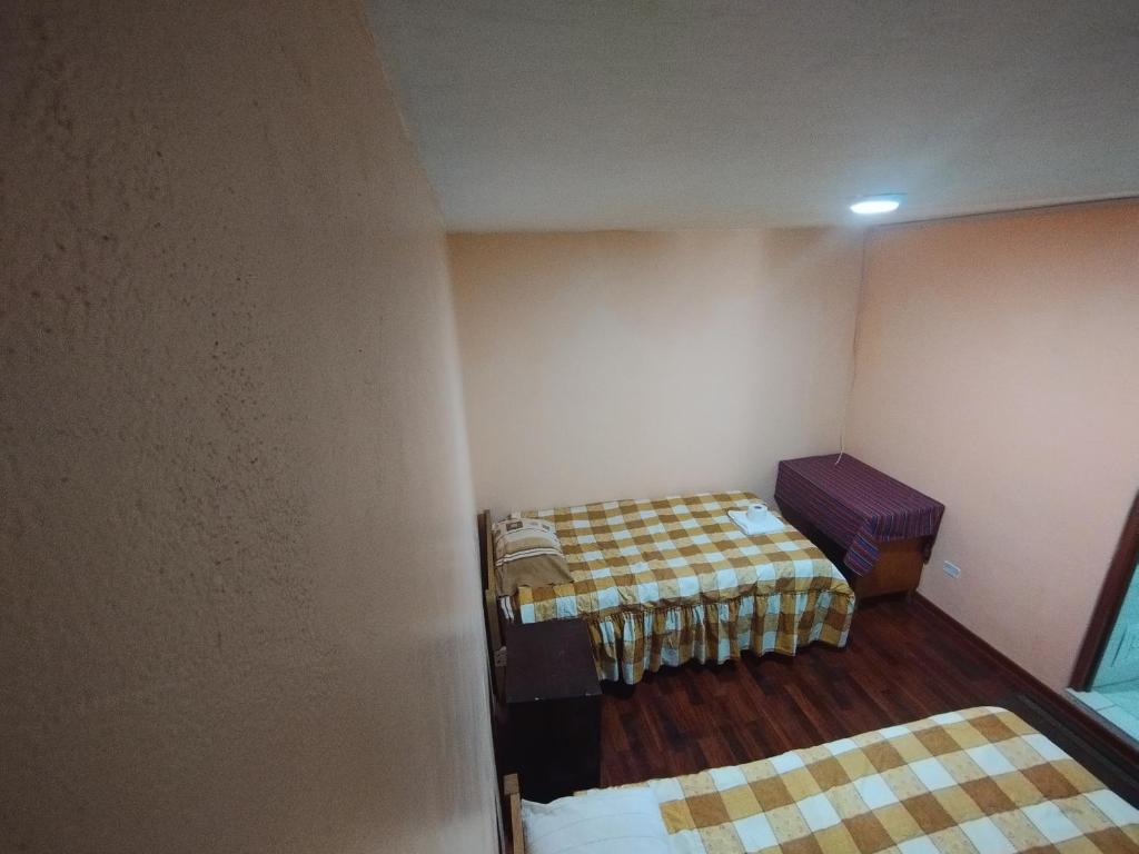 Postel nebo postele na pokoji v ubytování Inti Ut'ha