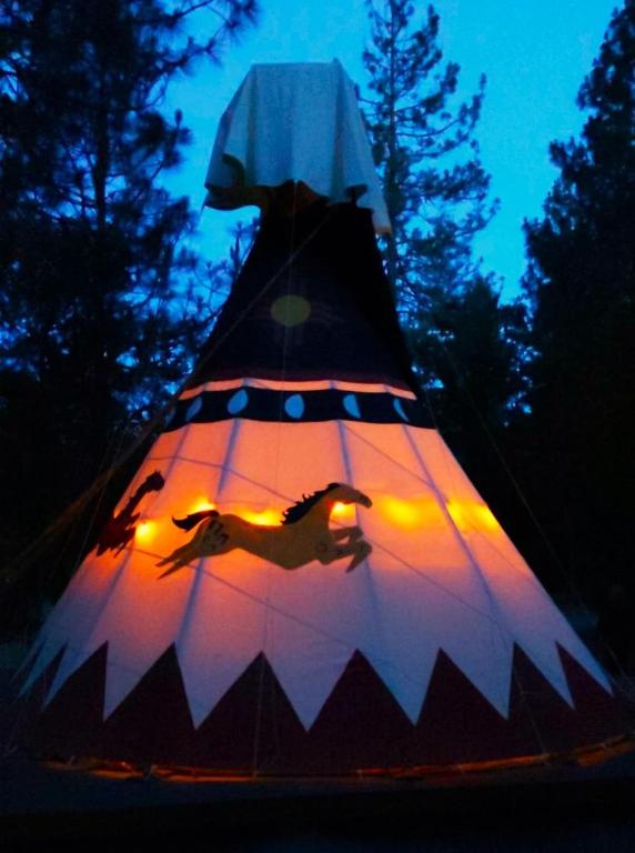 a lit up kite with a horse on it at Wild Horses Luxury Tipi - Adjustable King Bed in O'Brien