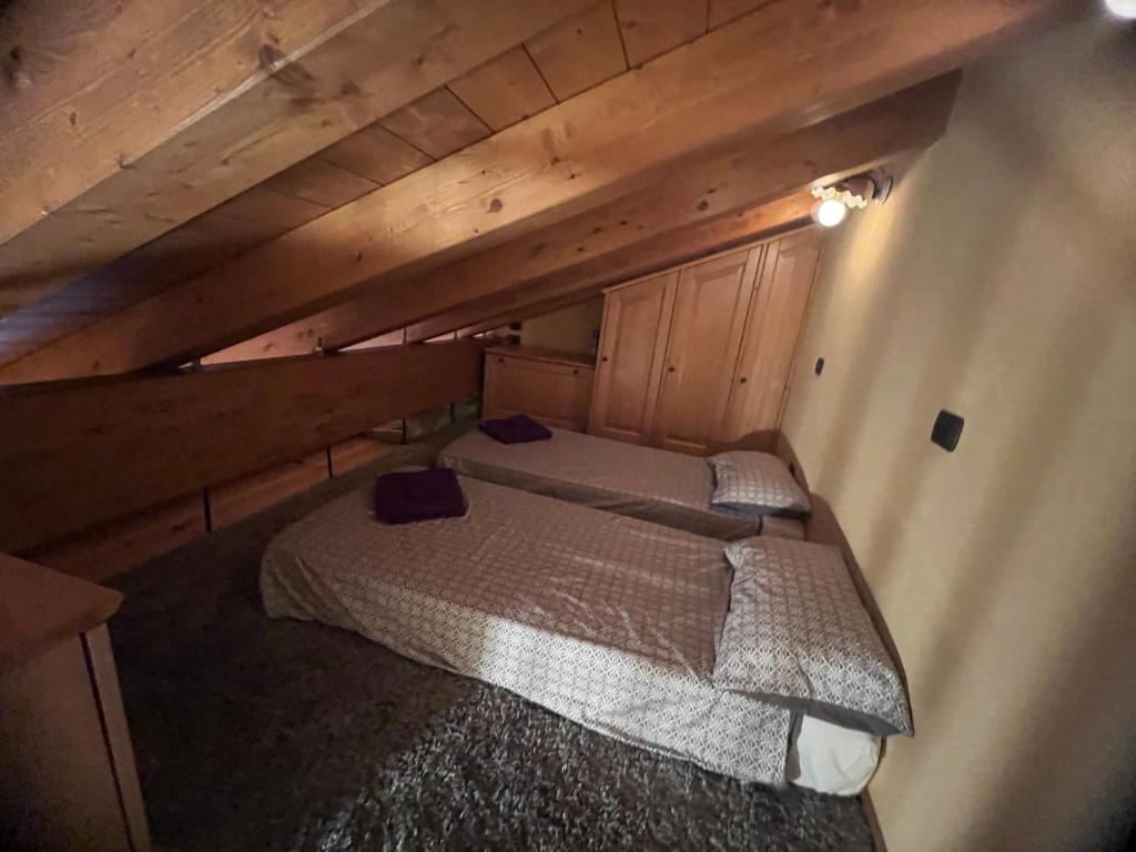A bed or beds in a room at Grandze du Pleiney