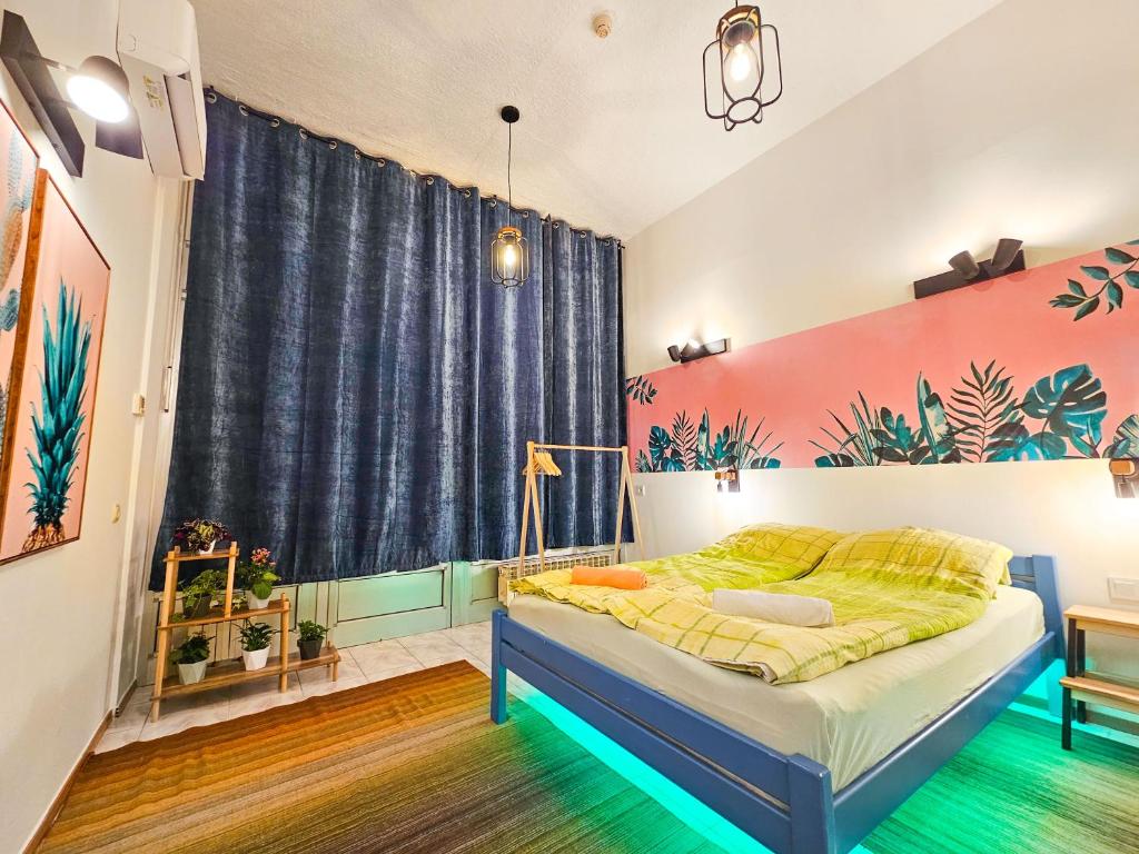 a bedroom with a bed and a large window at GlowLeaf Loft in Sarajevo