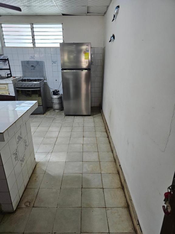 Η κουζίνα ή μικρή κουζίνα στο Cuartos independientes con baño privado - Casa La Dolce Vita Las Tablas