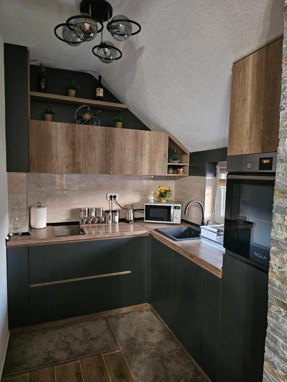 Kuchyň nebo kuchyňský kout v ubytování SOUL Apartman