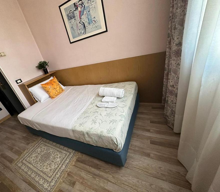 Postel nebo postele na pokoji v ubytování Hotel Raffaello Venice