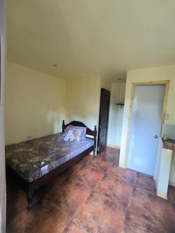 a bedroom with a bed in a room at Toto's House Room Rental in Puerto Princesa City