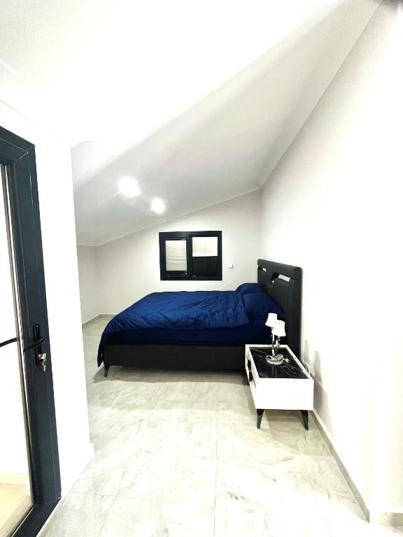 Postel nebo postele na pokoji v ubytování Premium Homes