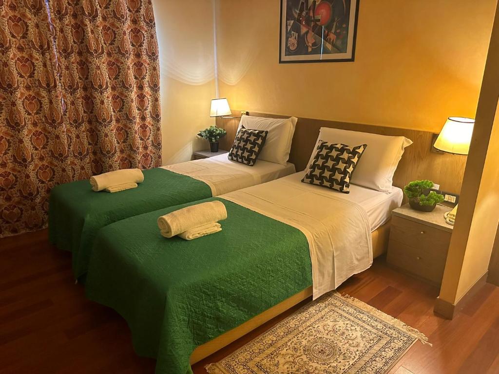 Postel nebo postele na pokoji v ubytování Hotel Raffaello Venice
